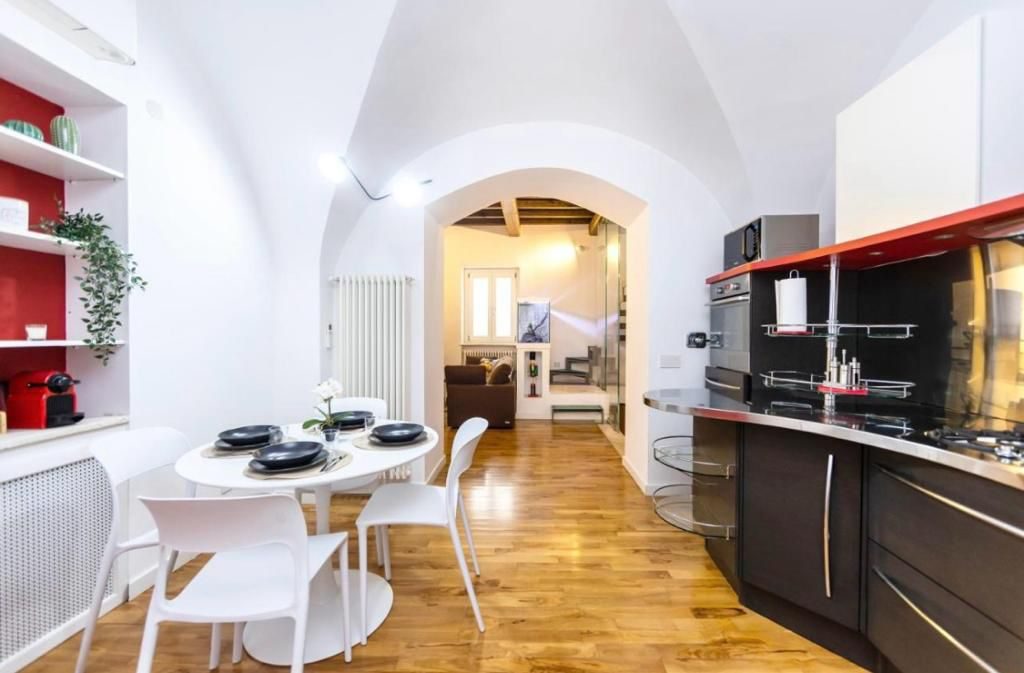 Zona giorno open space di Solaria con cucina e sala da pranzo